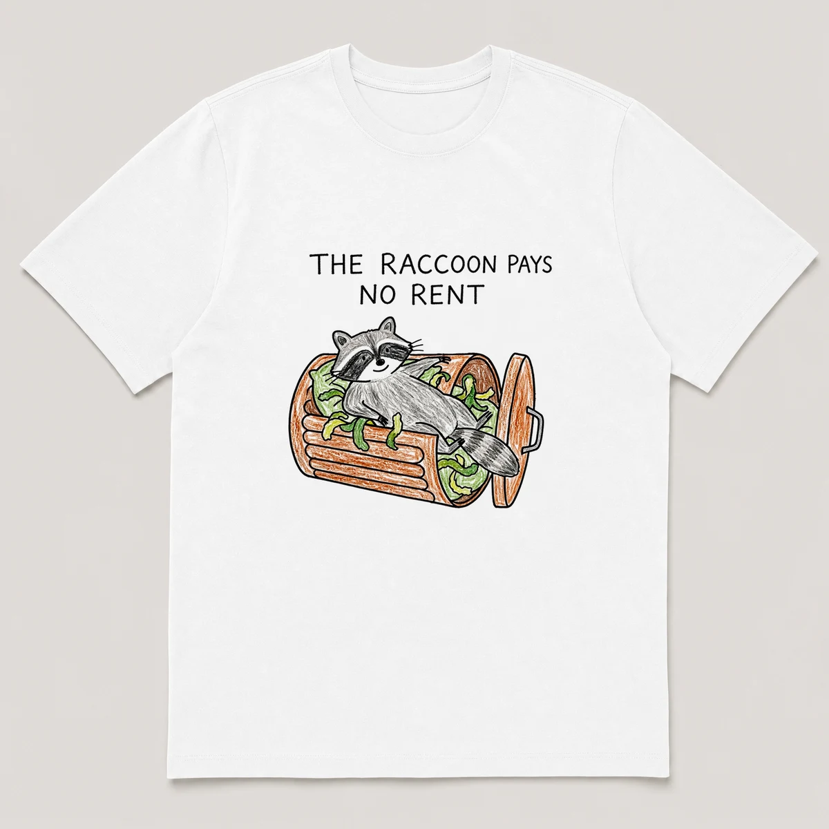 Front view of a White Tee printed with raccoon lounges like a king inside an overturned trash can with peelings as cushions and the caption THE RACCOON PAYS NO RENT, White front view