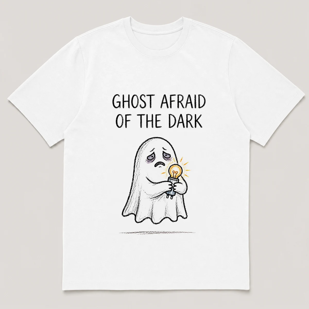 Front view of a White Tee printed with sheet ghost clutches a glowing nightlight in a dark hallway and the caption GHOST AFRAID OF THE DARK, White front view